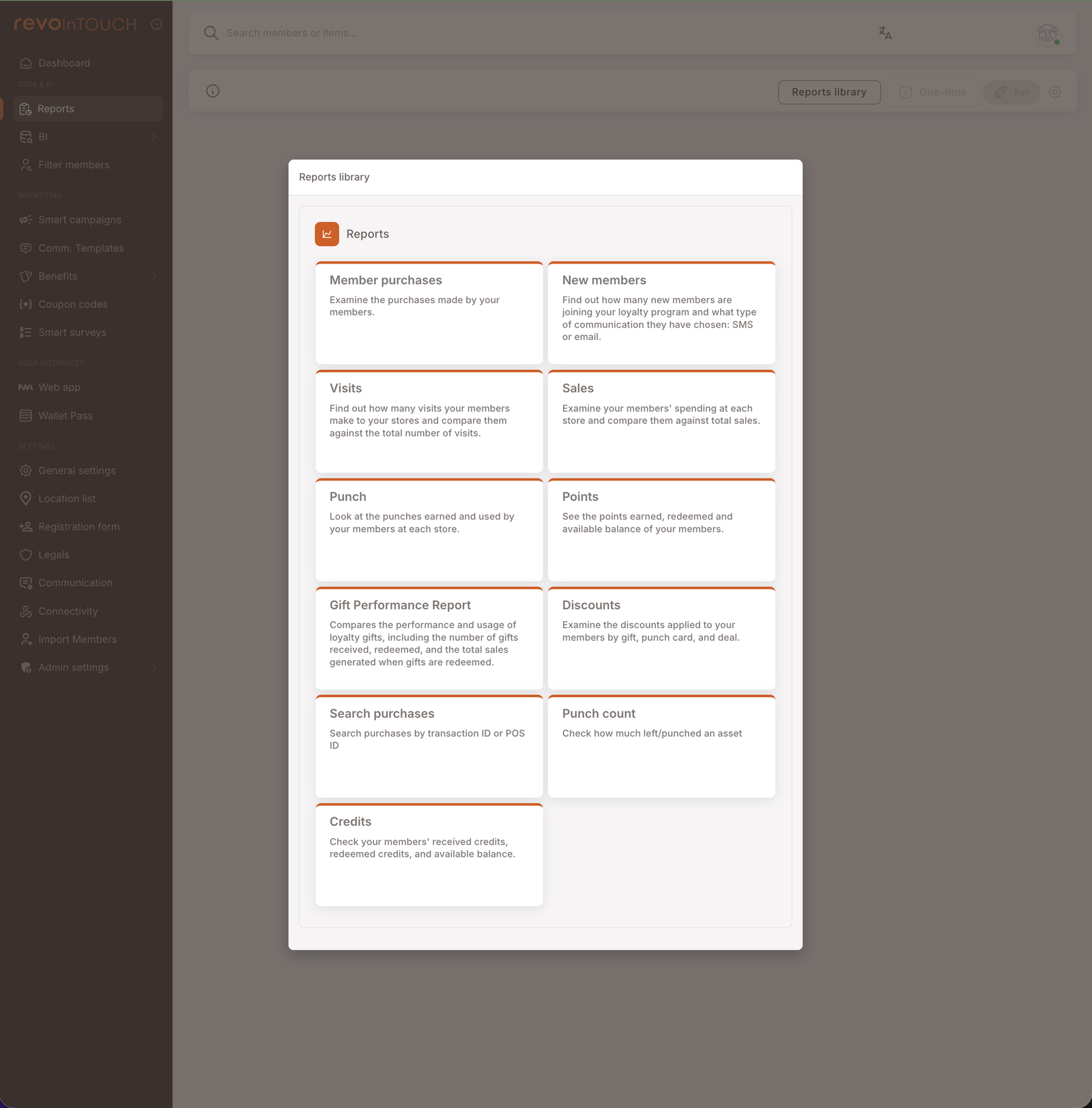 The Reports library — a modal showing 11 report cards in a two-column grid: Member purchases, New members, Visits, Sales, Punch, Points, Gift Performance Report, Discounts, Search purchases, Punch count, Credits. Each card has the report name and a one-line description.